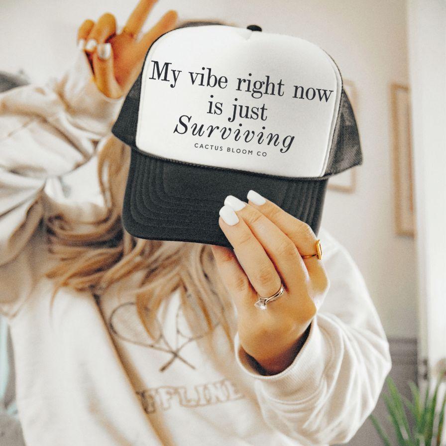 VIBE RIGHT NOW IS JUST SURVIVING EMBROIDERED TRUCKER HAT - Cactus Bloom Co.